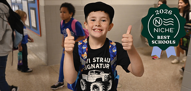male student with thumbs up